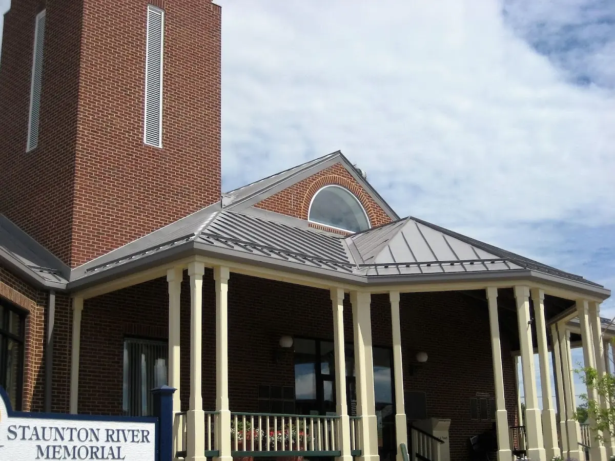 Skilled roofing craftsmen working on a residential roof in Frenchtown